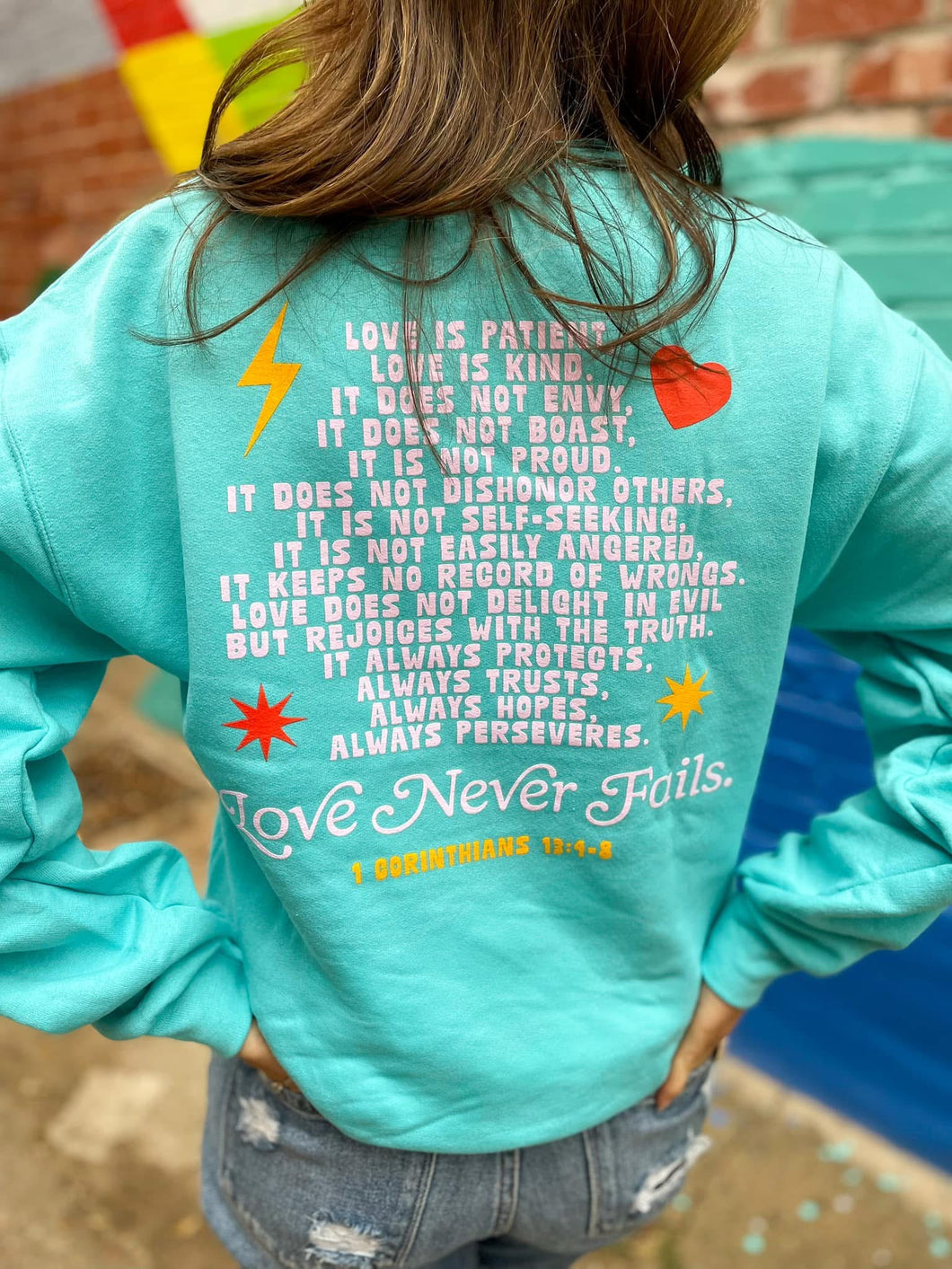 SMILEY LOVE NEVER FAILS Sweatshirt